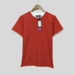 a red t - shirt with a tag on it